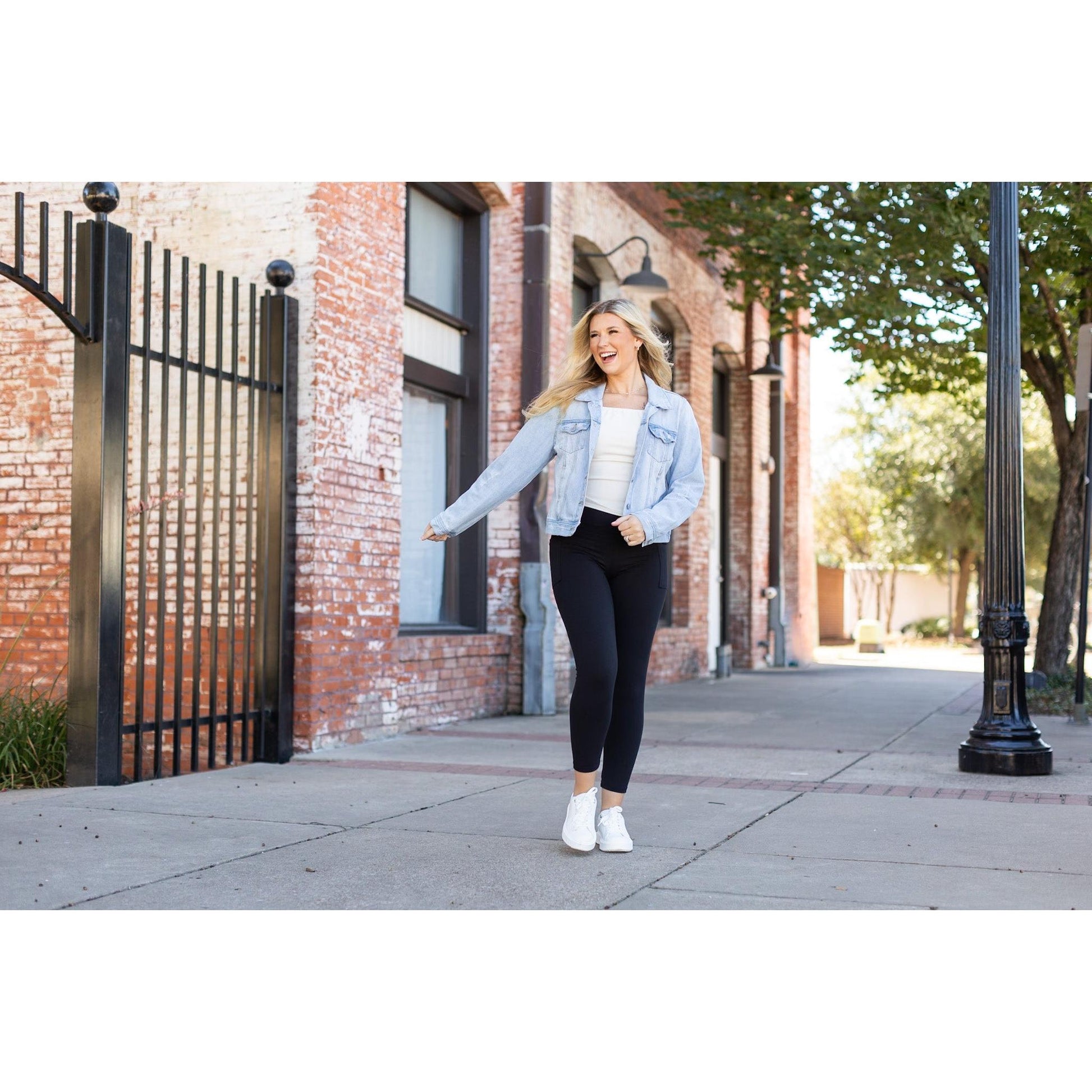 High-waisted black ankle length leggings with pockets by Julia Rose, Julia Rose women’s black 7/8 leggings lifestyle image