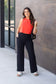 High-waisted black wide leg pants with pockets by Julia Rose, Julia Rose women’s wide leg pants lifestyle image