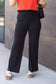 High-waisted black wide leg pants with pockets by Julia Rose, Julia Rose women’s wide leg pants lifestyle image